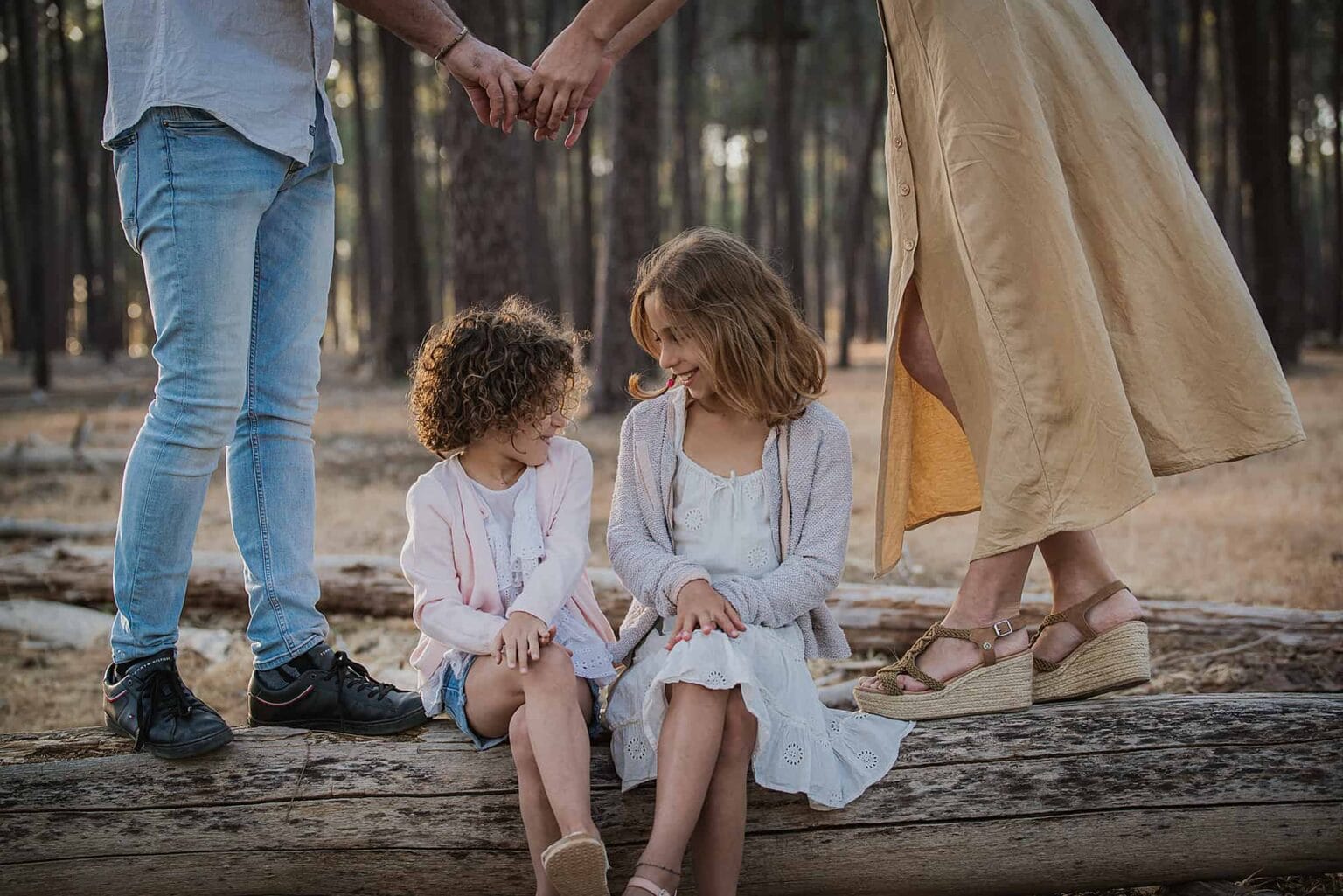 Family holding hands in a Perth forest, photographed by Cobo Photography